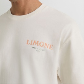 Model wearing Reiss white crew neck sweatshirt with coral Limone Amalfi Coast slogan print to chest