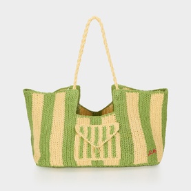 Damson Madder Apple Stripe tote bag in green and cream woven paper with rope handles and front pocket detail.