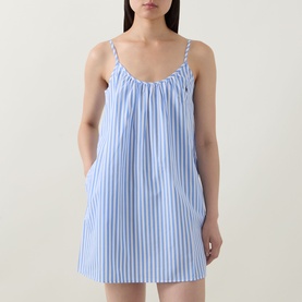 Model wearing Polo Night Dress in White Cloud x Hydrangea stripe, sleeveless mini length with gathered neckline and side pockets