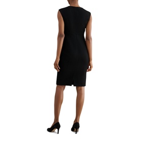 Model wearing Hobbs black sleeveless sheath dress, rear view, styled with black pointed-toe heels.