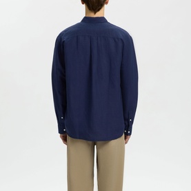 Model wearing Selected Casual Shirt in Ocean Cavern, rear view, relaxed fit with button cuffs, styled with beige trousers
