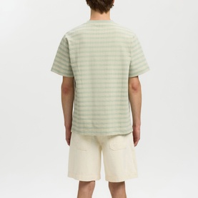 Model wearing Selected Aqua Gray striped crew neck T-shirt, rear view, styled with cream shorts