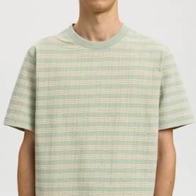 Model wearing Selected Crew Neck T in Aqua Gray, short-sleeve relaxed fit with horizontal stripe texture, crew neckline