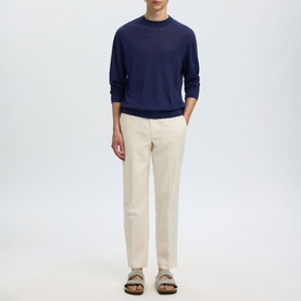 Model wearing Selected Ocean Cavern crew neck knit with cream tailored trousers and tan sandals
