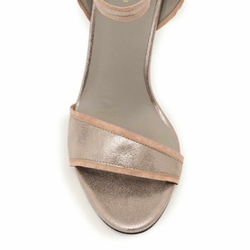 Rose gold metallic open-toe sandal with wide cross strap and ankle strap, viewed from above on grey background