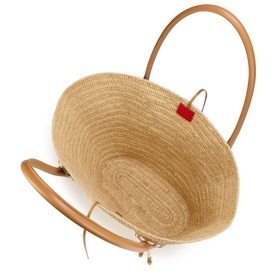 Christian Louboutin woven straw tote bag with tan leather top handle and trim, red logo tab, overhead interior view