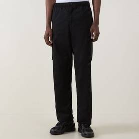Model wearing Calvin Klein Jeans Twill Cargo Trousers in black, straight-leg fit with cargo pockets, styled with chunky trainers