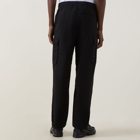Model wearing Calvin Klein Jeans Twill Cargo Trousers in black, straight-leg fit with cargo pockets and elasticated waistband, rear view
