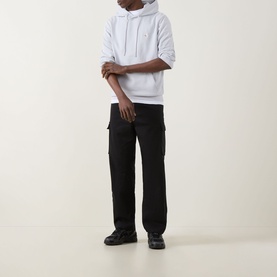 Model wearing Calvin Klein Jeans Twill Cargo Trousers in black, straight-leg fit with cargo pockets, styled with a white hoodie and black trainers.