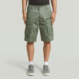 Model wearing G-Star Shorts in LT ORPHUS, relaxed fit with large cargo pockets, styled with white socks and grey trainers