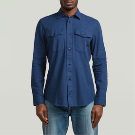 Model wearing G-Star Slim Shirt in Rank Blue GD, two chest pockets, button-front, styled with light blue jeans