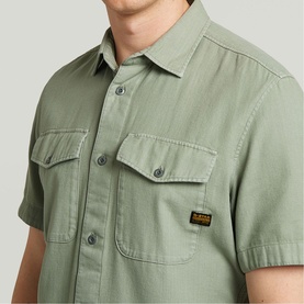 Model wearing G-Star Slim Shirt in Lt Orphus green, short-sleeve with twin chest flap pockets and branded logo tab