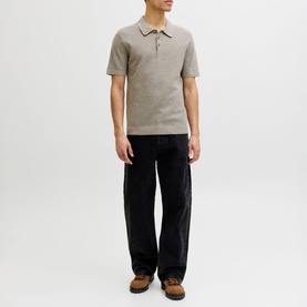 Model wearing Jack & Jones Riley Knit Polo Shirt in brown with quarter-button fastening, styled with black wide-leg trousers and brown boots