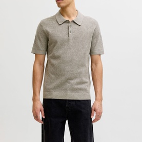 Model wearing Jack & Jones Riley Knit Polo Shirt in brown, quarter-button fastening, short sleeves, styled with dark trousers
