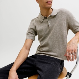 Model wearing Jack & Jones Riley Knit Polo Shirt in brown, quarter-button fastening, short sleeves, styled with dark jeans
