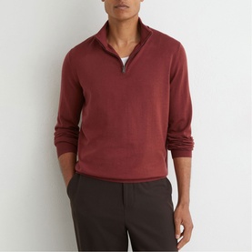 Model wearing Reiss rooibos red quarter-zip knit jumper, styled with dark grey trousers