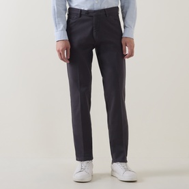 Model wearing Meyer grey slim-fit cotton trousers, styled with a light blue shirt and white trainers.