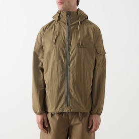 Model wearing Barbour clay casual jacket with hood, zip fastening, sleeve pocket, and elasticated cuffs, styled with matching trousers