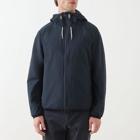 Model wearing Barbour navy casual jacket with attached drawstring hood, full-length zip fastening and raglan sleeves