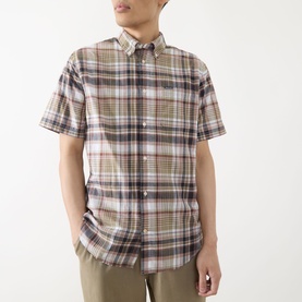 Model wearing Barbour Baycliff Logo Check Print Shirt in Burnt Pepper, short sleeves, button-down collar, styled with khaki trousers.