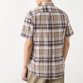 Model wearing Barbour Baycliff Logo Check Print Shirt in Burnt Pepper. Back view showing check pattern, short sleeves and curved hem.