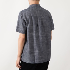 Model wearing Barbour Bowston Patch Pocket Logo Shirt in Dark Navy, rear view, short sleeves, relaxed fit with centre back pleat detail.