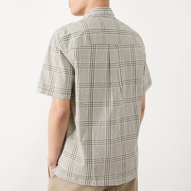 Model wearing Barbour Carrock Seersucker Check Print Shirt in Whisper White, short sleeves, check pattern, back view