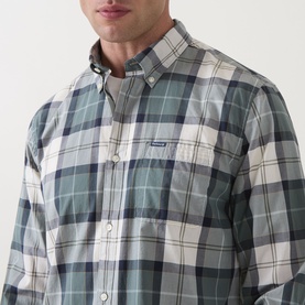 Model wearing Barbour Rawley Tartan Shirt in Meadow Brook Tartan, showing button-down collar, chest pocket and logo badge detail.