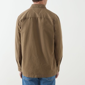 Model wearing a khaki brown overshirt jacket, rear view, paired with blue denim jeans