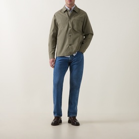 Model wearing Barbour Dusty Olive cotton casual shirt, styled with blue jeans and dark brown leather shoes.