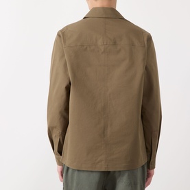 Model wearing Barbour Strick Flap Pocket Overshirt in Clay, rear view showing shirt collar, long sleeves and straight hem.