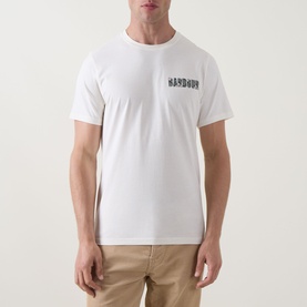 Model wearing Barbour Crew Neck T in Whisper White with small chest logo print, styled with beige chinos.