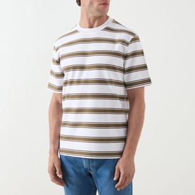 Model wearing Barbour white crew neck T-shirt with khaki and navy bold horizontal stripes, short sleeves, styled with blue jeans