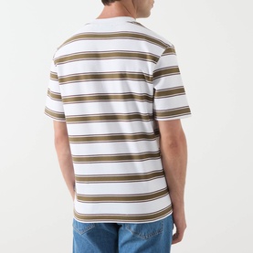 Model wearing Barbour white crew neck T-shirt with khaki and brown horizontal stripes, short sleeves, styled with blue jeans. Rear view.