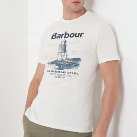 Model wearing Barbour Harbourside Graphic T-Shirt in Whisper White with navy lighthouse graphic print, paired with khaki trousers.