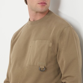 Model wearing Barbour clay cotton crew neck sweatshirt with chest patch pocket and D-ring detail