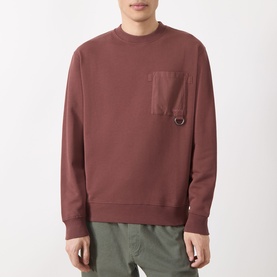 Model wearing Barbour Ivergill Patch Pocket Sweatshirt in Burnt Pepper, crew neck with contrast chest patch pocket and D-ring detail, styled with