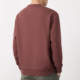 Model wearing Barbour Ivergill Patch Pocket Sweatshirt in Burnt Pepper, crew neck, long sleeves, ribbed trims, back view.