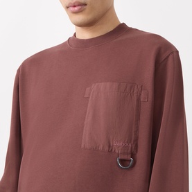 Model wearing Barbour Ivergill Patch Pocket Sweatshirt in Burnt Pepper with contrasting chest patch pocket and D-ring detail.