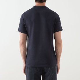 Model wearing Barbour Crew Neck T in Dark Navy, rear view, short sleeves, styled with navy trousers