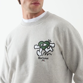 Model wearing Barbour Grey Marl cotton crew neck sweatshirt with green heart graphic logo print on chest, styled over white T-shirt.