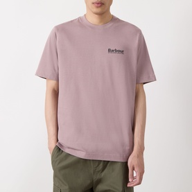 Model wearing Barbour Moonwell Graphic Logo T-Shirt in Ironstone pink, featuring crew neck, short sleeves, and small chest logo print.