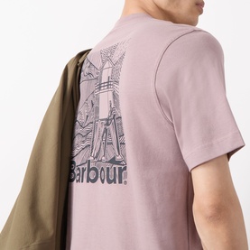 Model wearing Barbour Moonwell Graphic Logo T-Shirt in Ironstone, showing rear graphic print, styled with an olive jacket over the shoulder.