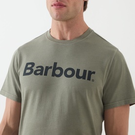 Model wearing sage green Barbour logo T-shirt with bold navy chest print, cropped close-up view