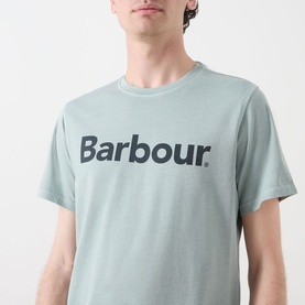 Model wearing Barbour Washington Overdyed Logo T-Shirt in Dusty Slate, crew neck with contrast logo lettering across chest.