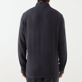 Model wearing Barbour Dark Navy cotton half-zip sweatshirt, rear view, with striped cuff detailing visible at wrists.
