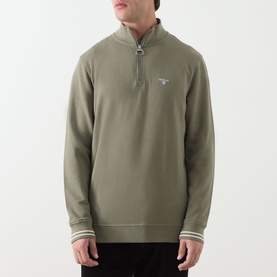 Model wearing Barbour Rosford Logo Half-Zip Sweatshirt in Dusty Olive with funnel neck, half-zip placket, tipped cuffs and chest logo embroidery