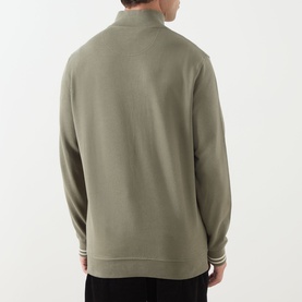 Model wearing Barbour Rosford Logo Half-Zip Sweatshirt in Dusty Olive, showing rear view with tipped cuffs and ribbed hem detail.