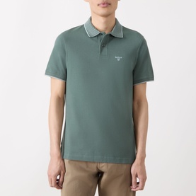 Model wearing Barbour Vintage Teal cotton polo shirt with contrast tipped collar, short sleeves, and small chest logo.