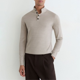 Model wearing Reiss stone mouline knit top with mock neck and button placket, styled with dark brown trousers